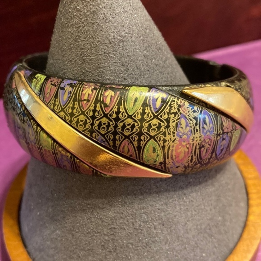 Gold tone infused metal on colored lacquer hinged bracelet bangle